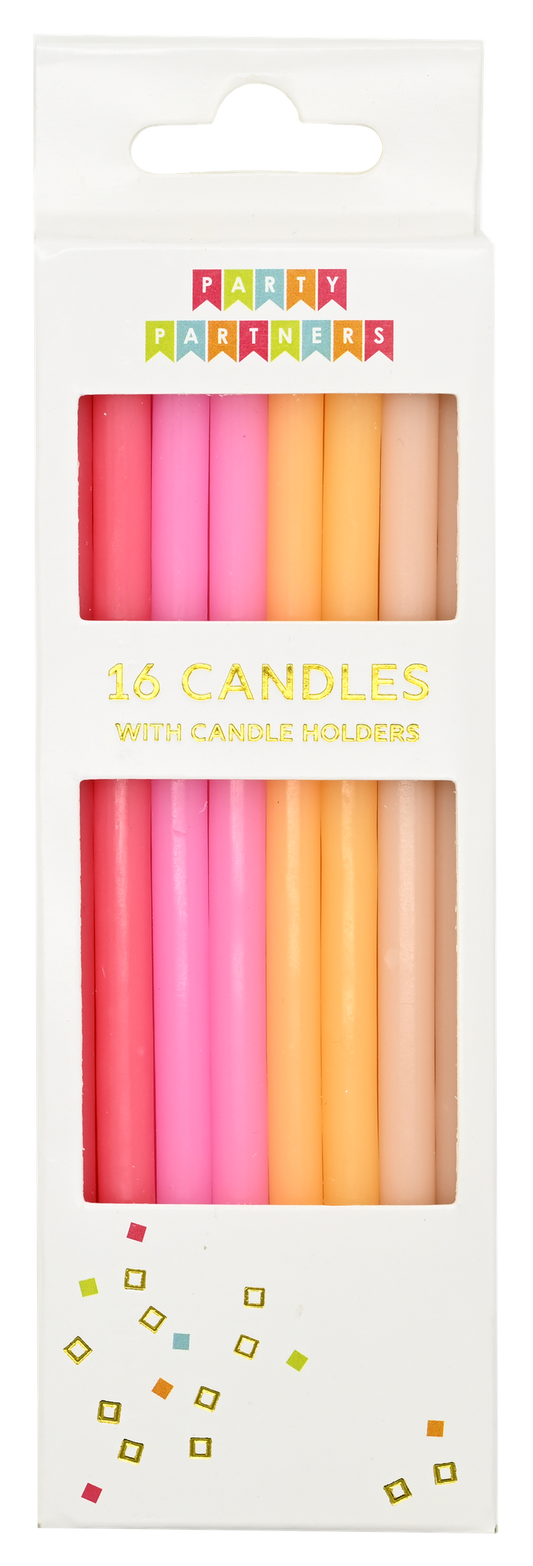 Pack of colorful birthday candles with holders in a white box