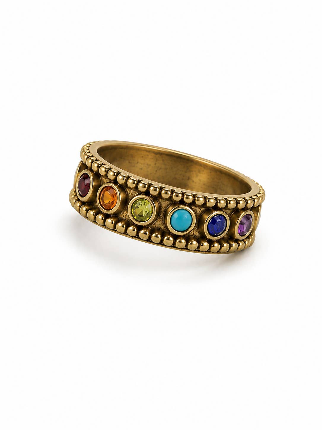 A brass ring with a beaded border and seven colorful gemstones in a row, set against a plain white background.