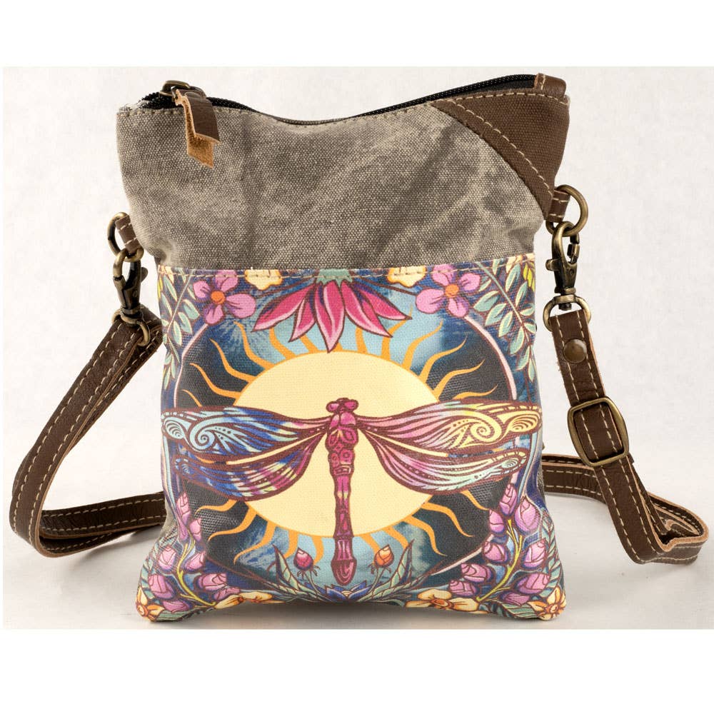 Crossbody bag with dragonfly design on a white background