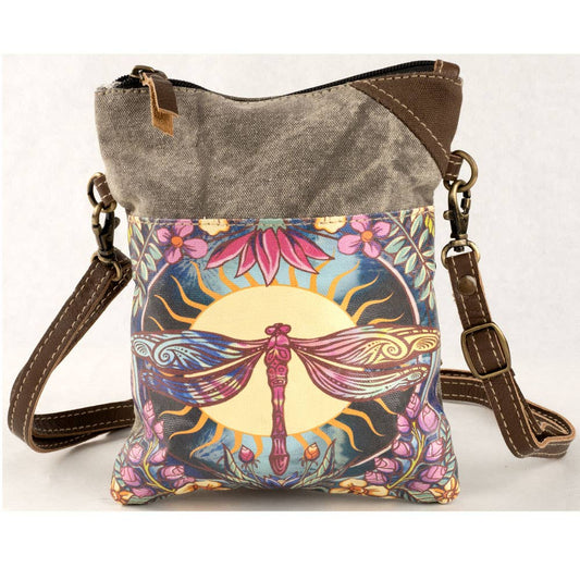 Crossbody bag with dragonfly design on a white background