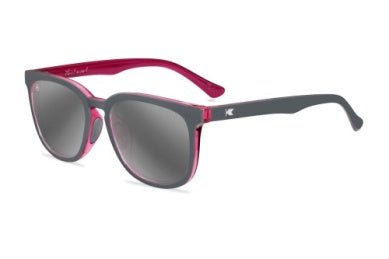 Knockaround sunglasses with pink and gray frame on a white background