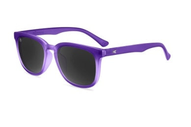 Purple Knockaround sunglasses with dark lenses, shown at a three-quarter angle on a plain white background.